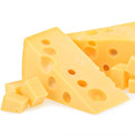 Zwei Stück Käse mit kleinen Käsestücken davor auf weißem Hintergrund